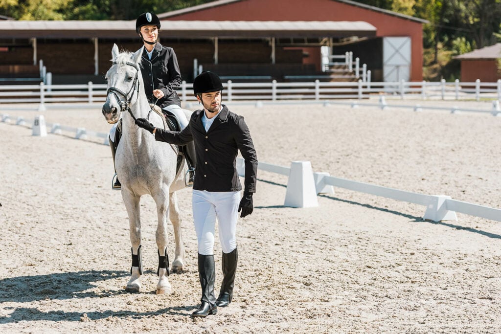 Riders wearing white breeches